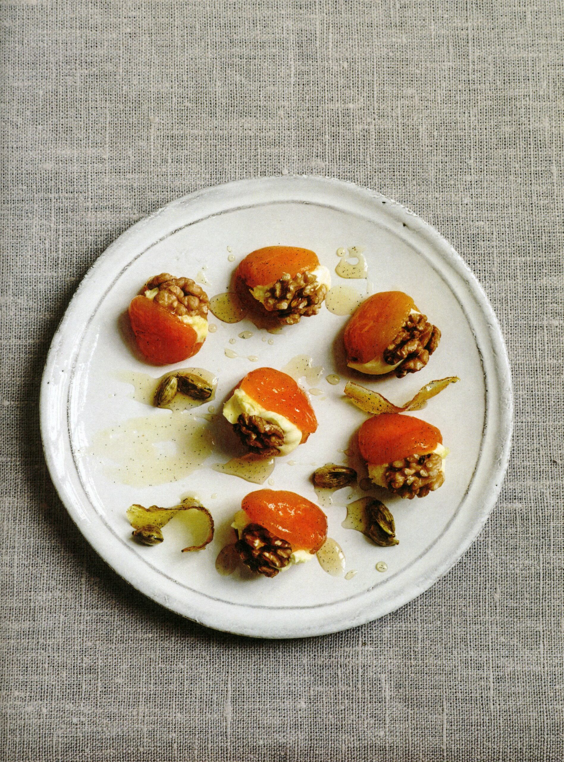 Persiana Syrup poached apricots with walnuts and clotted cream